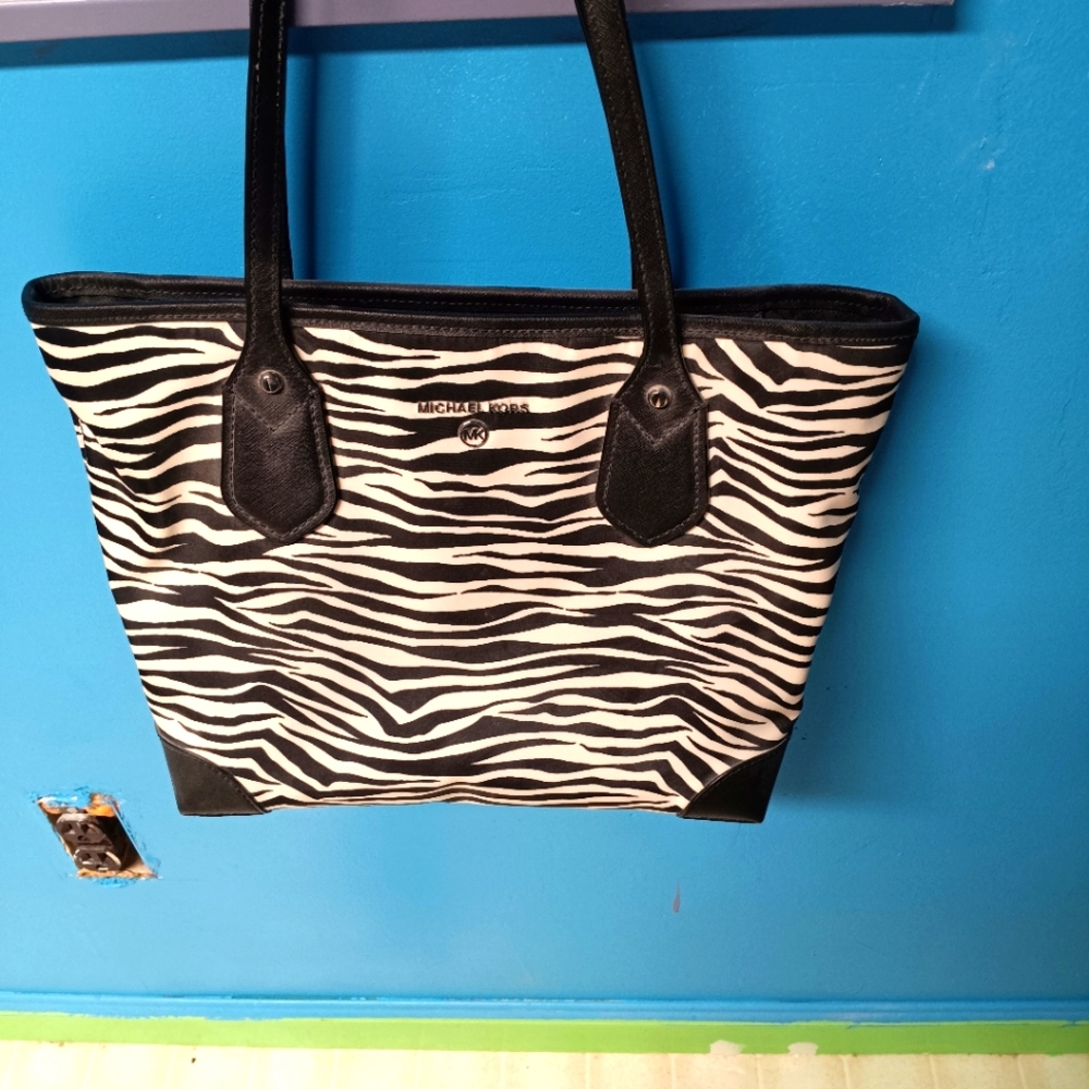 Michael Kors Medium size zebra print bag.